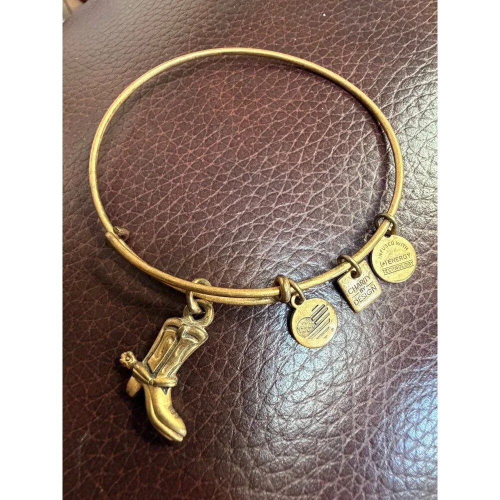 Alex and Ani Cowboy Boot charm bracelet featuring a gold-toned expandable bangle